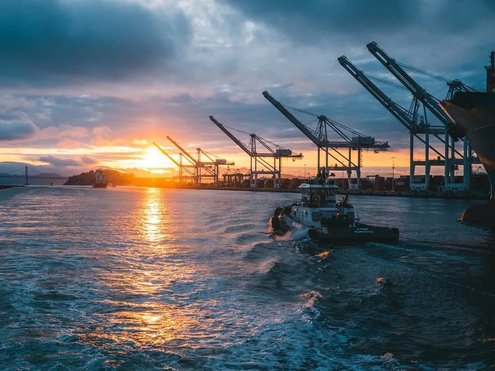 Port cranes at sunset